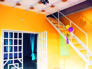 a bunk bed in a room with balloons and a ceiling at Hiremane Residency in Sringeri