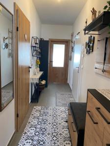a hallway with a door and a tile floor at Moderne Kaminstube in Ramsau am Dachstein
