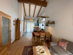 a living room with a couch and a table at Moderne Kaminstube in Ramsau am Dachstein