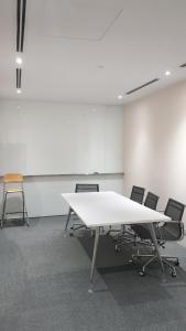 an empty room with a white table and chairs at MCity Jalan Ampang KLCC in Kuala Lumpur +135 photos