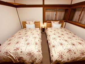 Een bed of bedden in een kamer bij 2nd House