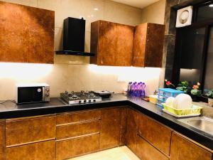 Dapur atau dapur kecil di Room in Airb&b New Delhi - Divine Inn Service Apartments