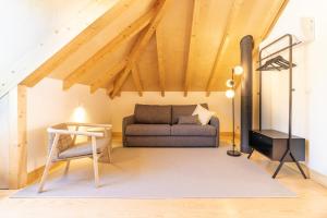 a living room with a couch and a table at Casa Nova Rural in Nelas