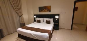 En eller flere senge i et værelse på Nawara AL ASKARY