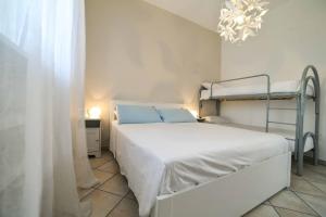 A bed or beds in a room at La Caletta Bed and Breakfast