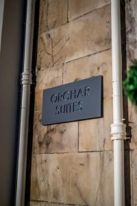 a sign on the side of a building at Casa Fresa - Orchar Suites in Dundee