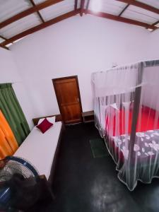Letto o letti in una camera di Rainforest River Bay