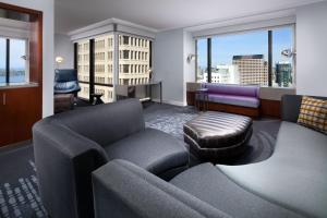 a living room with a couch and a chair at W Seattle in Seattle +128 photos