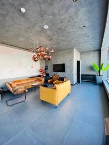 a living room with a couch and a table at Marshall Apartment 202 in Gudauri