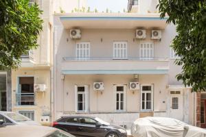 a building with cars parked in front of it at Splendid Full 5BDR/3bath/2kitchens Mansion in ATH in Athens