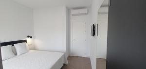 Łóżko lub łóżka w pokoju w obiekcie JOSE APARTAMENTo