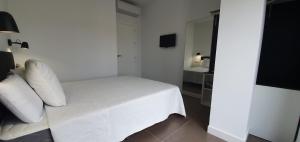 Łóżko lub łóżka w pokoju w obiekcie JOSE APARTAMENTo