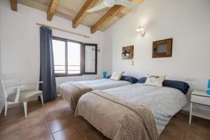 Säng eller sängar i ett rum på Villa Alegria 55 Cala Serena
