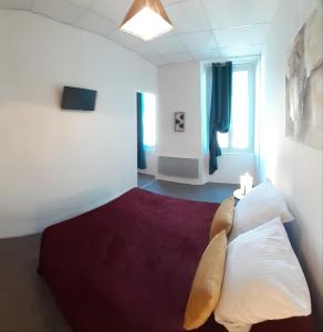 a hotel room with a bed and a window at Rose des Alpes in Serres
