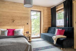 Postel nebo postele na pokoji v ubytování Highlander Heart Residence