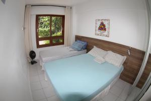 Katil atau katil-katil dalam bilik di Duplex na Praia do Forte de frente para o mar! +63 gambar