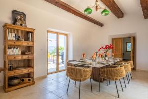 a large dining room with a table and chairs at Domain U Tempu Persu landscaped parc mini zoo in Porticcio