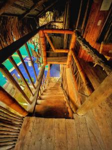 an overhead view of a wooden staircase in a building at La Perla Tayrona in El Zaino