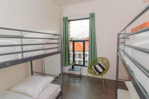 Letto o letti in una camera di Pink Flamingo Boutique Hostel