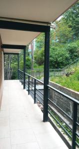 a walkway under a building with a bridge at Aparahik in Ushuaia