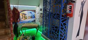 a room with a chair and a painting on the wall at Casa D Miros familias y Grupos y Empresas Max 20 p in Guadalajara