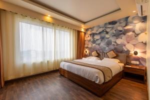 Voodi või voodid majutusasutuse Gorakha Hotel toas