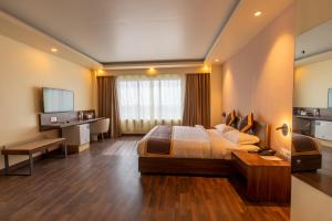 En eller flere senge i et værelse på Gorakha Hotel
