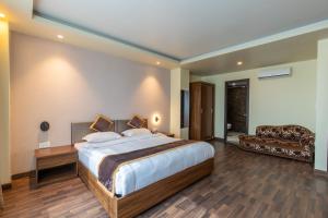 Voodi või voodid majutusasutuse Gorakha Hotel toas