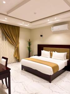 A bed or beds in a room at Qaser Sadan