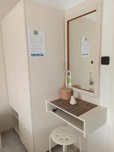 a dressing room with a mirror and a stool at Heras Garden in Vasiliki +92 photos