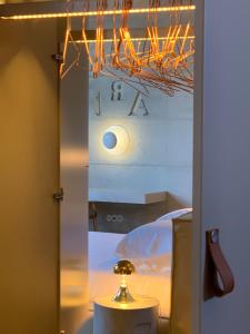 a room with a bedroom with a bed and a mirror at Element in Viseu +33 photos