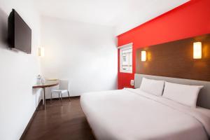 Postel nebo postele na pokoji v ubytování Amaris Hotel Samarinda