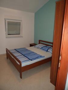 Posteľ alebo postele v izbe v ubytovaní Apartments Ewa