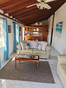 a living room with a couch and a coffee table at Breezy Apts in Saint Philip