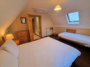 Voodi või voodid majutusasutuse Millstone Cottages toas