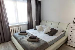 Posteľ alebo postele v izbe v ubytovaní Apartament Anna