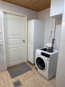 Kuchyň nebo kuchyňský kout v ubytování Cozy centre apartament Kuopio