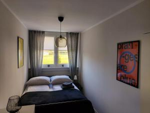 Llit o llits en una habitació de Apartament Rodzinny