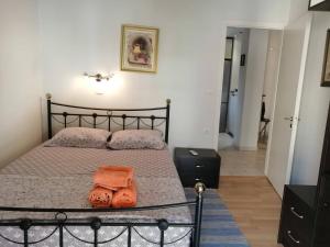 A bed or beds in a room at Flora's Boutique Apartment at the heart of Corfu