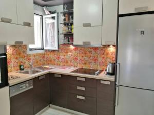 A kitchen or kitchenette at Flora's Boutique Apartment at the heart of Corfu