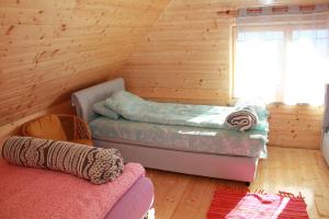 a room with a bed and a couch at Brvnara Zlatibor Tornik in Zlatibor +36 photos