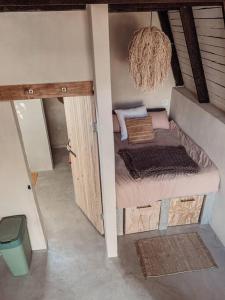 a room with a small bed in a house at Shepherds Rest in Hoedspruit