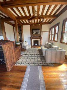 a living room with a couch and a fireplace at Hostal La Cofa in Viña del Mar