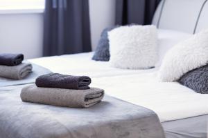 Posteľ alebo postele v izbe v ubytovaní Apartament Anna