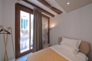 Posteľ alebo postele v izbe v ubytovaní HAMMAM Venice