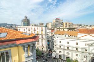 a view of a city skyline with buildings at A I R Rettifilo Apartments in Naples