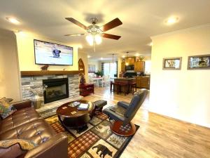 a living room with a couch and a fireplace at Mountain views, pets welcome-lake and river access in Lake Lure