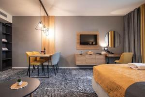 Televízia a/alebo spoločenská miestnosť v ubytovaní Apartmán Drahokam Bešeňová