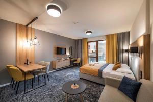 Posteľ alebo postele v izbe v ubytovaní Apartmán Drahokam Bešeňová