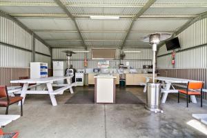 a large room with tables and chairs in it at Traralgon Holiday Village in Traralgon